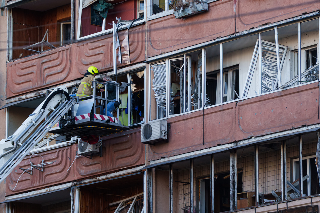 Russia hammers Ukraine for a 3rd straight day, flattening a Kyiv apartment block and killing 5