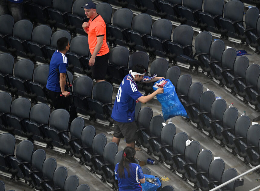 Japan fans use blue bags to uphold a cleansing World Cup tradition after draw