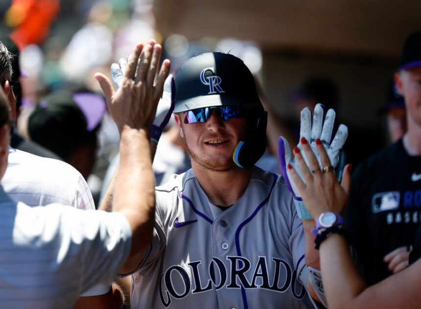 Rockies set club record for runs with 23-9 victory over A’s in Las Vegas heat