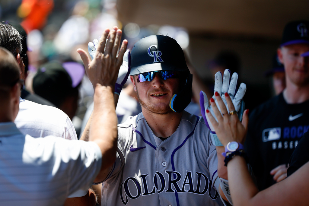 Rockies set club record for runs with 23-9 victory over A’s in Las Vegas heat
