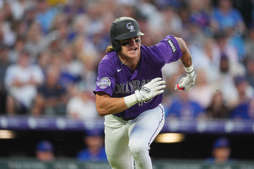 Cole Carrigg triples in Rockies debut and plays with his `hair on fire,’ manager says