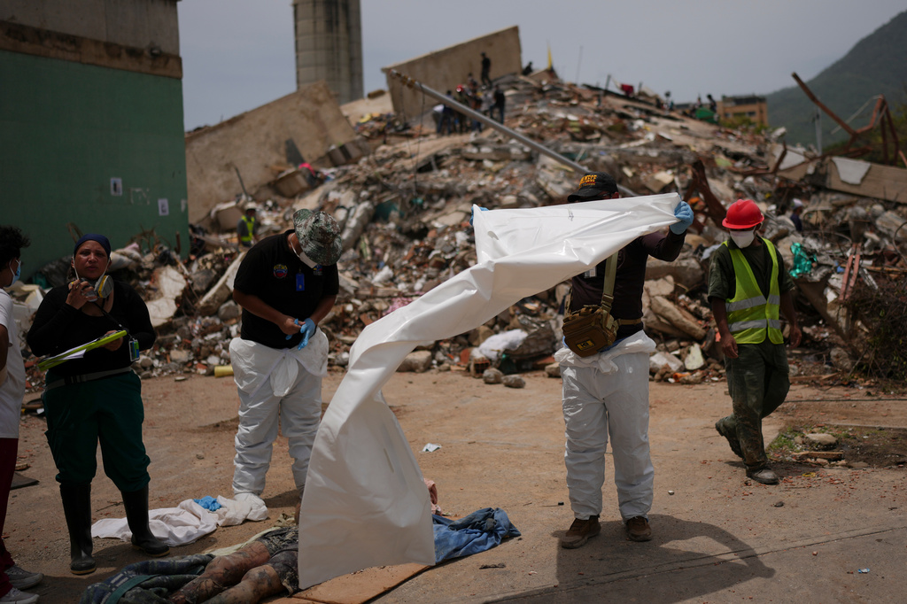 Venezuelans are rushing to identify the bodies of their loved ones as earthquake deaths multiply