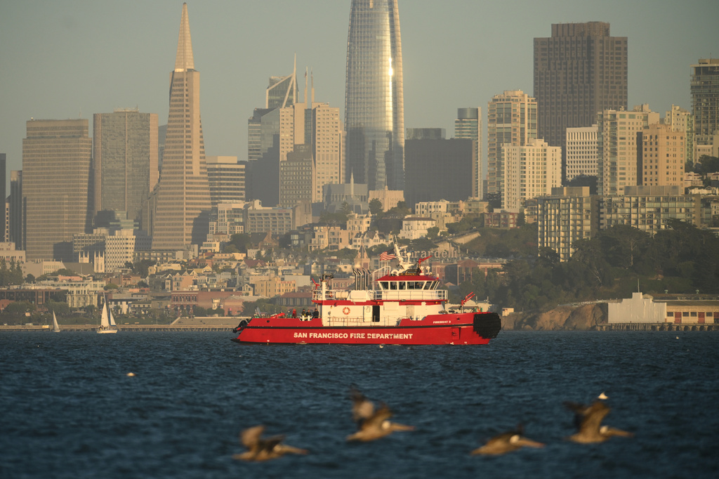 Rescuers are still searching for 3 people after a boat sank in San Francisco Bay, leaving 1 dead