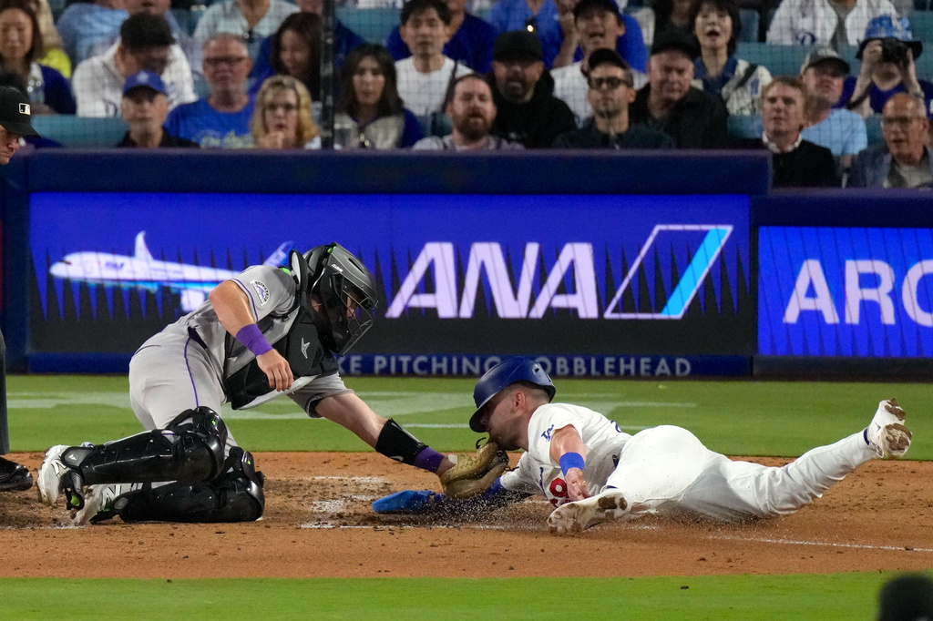 Rockies rally past the Dodgers 4-3 after 2 errors in the eighth