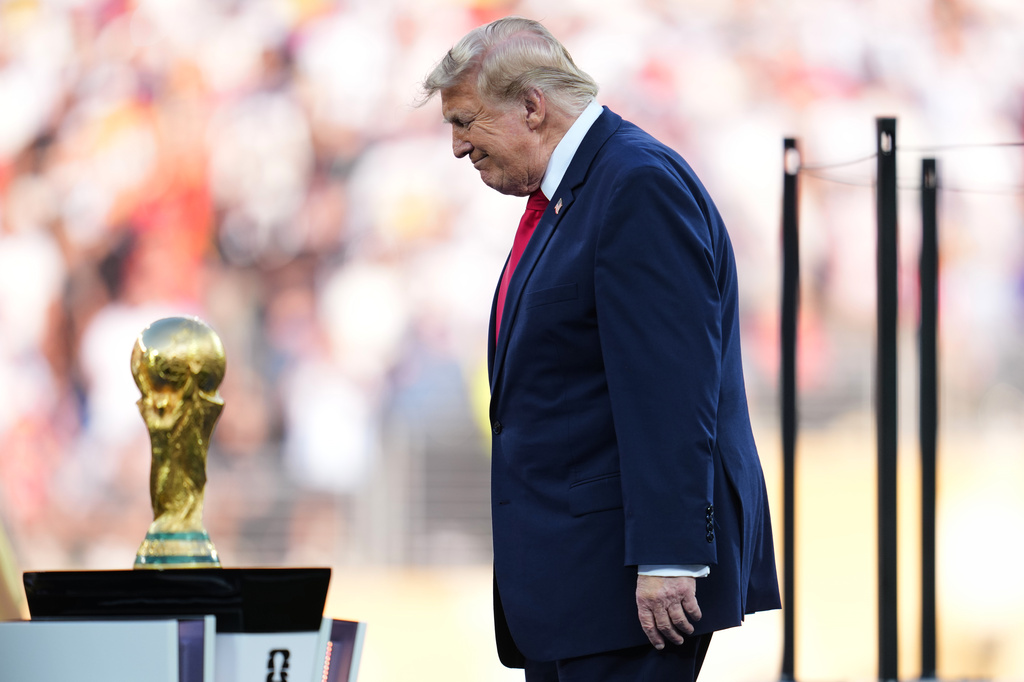Trump celebrates the World Cup as a US victory as he presents trophy to the winner, Spain