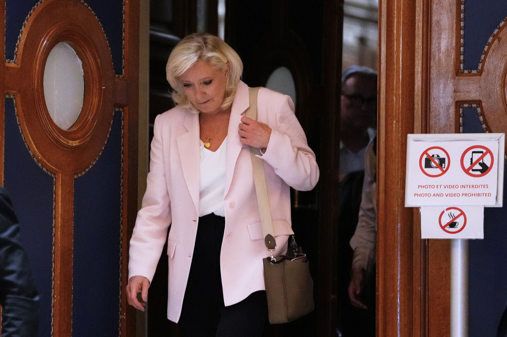 French court clears way for far-right leader Le Pen to run in 2027 but under a condition she rejects