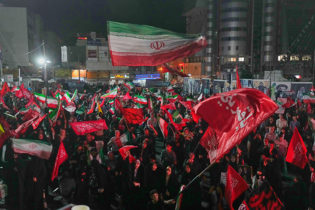 Iran says it is suspending commitments to interim deal with US as they exchange attacks