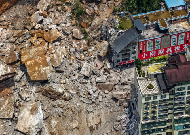 A landslide in southwest China buries homes and forces more than 1,000 to evacuate
