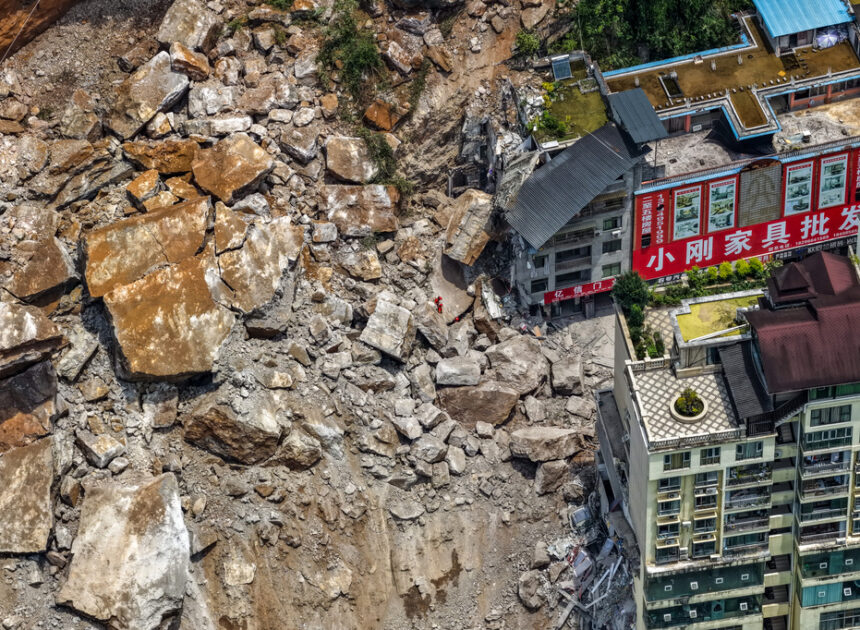 A landslide in southwest China buries homes and forces more than 1,000 to evacuate