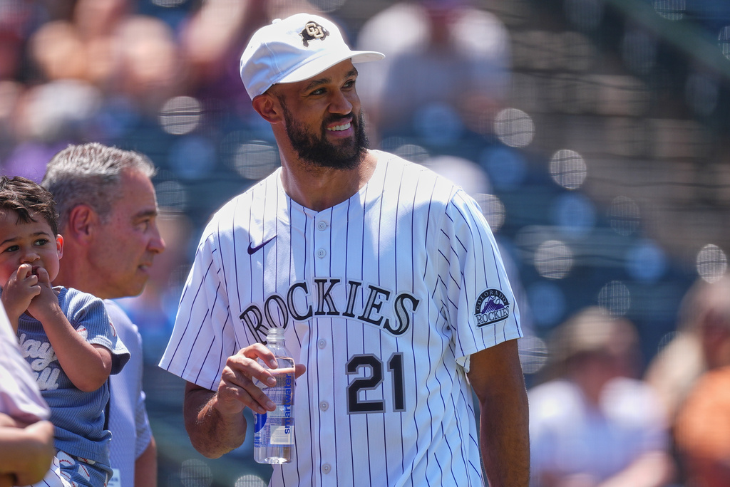 Kyle Karros hits a 3-run homer in the 8th to lift the Rockies past the Giants, 7-6