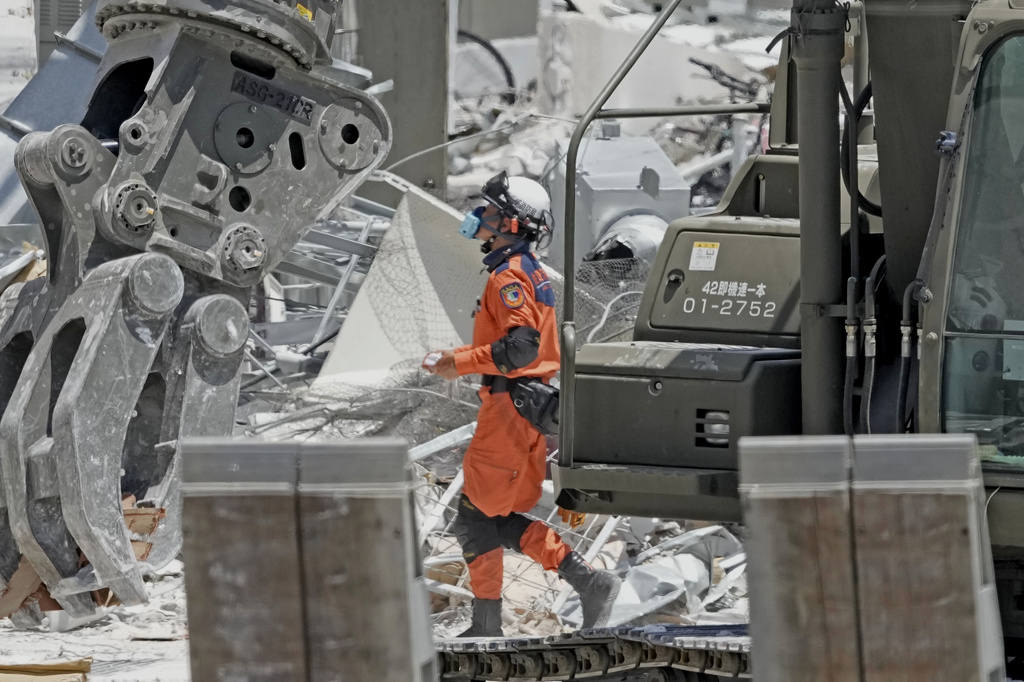 Quake survivors in southwestern Japan sleep in cars in sweltering heat as death toll rises to 34