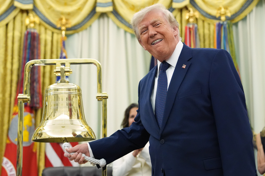 Trump rings Wall Street’s opening bells as he ties his presidency to stock market gains