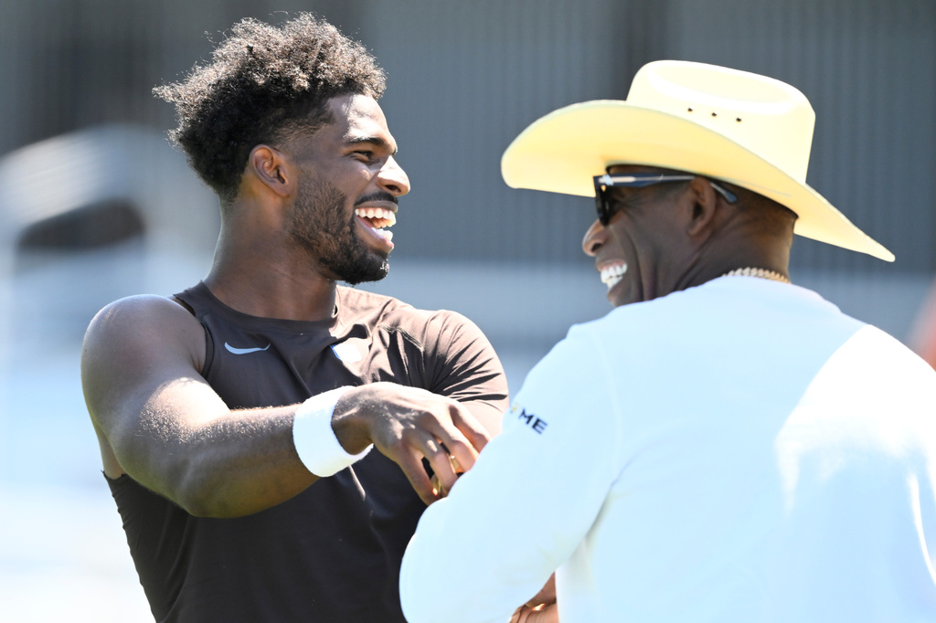 From ‘stay away’ to the bleachers: Deion Sanders visits Browns’ camp as Shedeur vies for starting QB