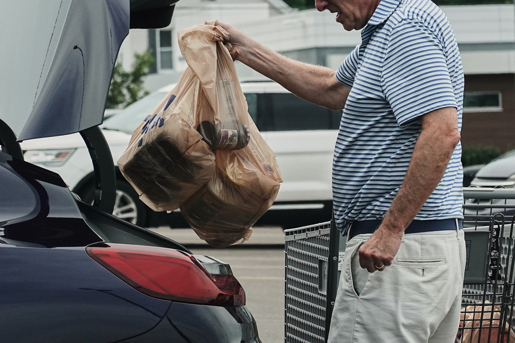 Inflation cooled last month as gas prices fell, though costs remain elevated