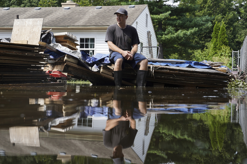 At least 7 people have died from days of heavy rain and record-setting flooding in Indiana
