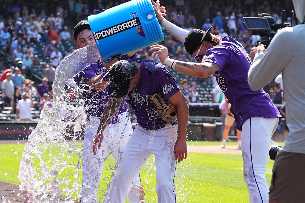 Native son Freeland dazzles in a complete game as Rockies sweep Royals 8-1 at steamy Coors Field