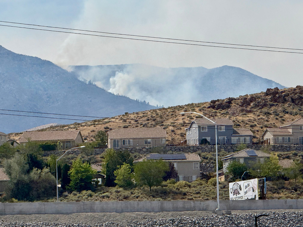 Fast-moving wildfire amid shifting winds threatens Reno, Nevada, forcing thousands to evacuate